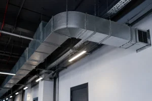 Industrial ceiling duct system showing clean metal vents for post-renovation duct cleaning.